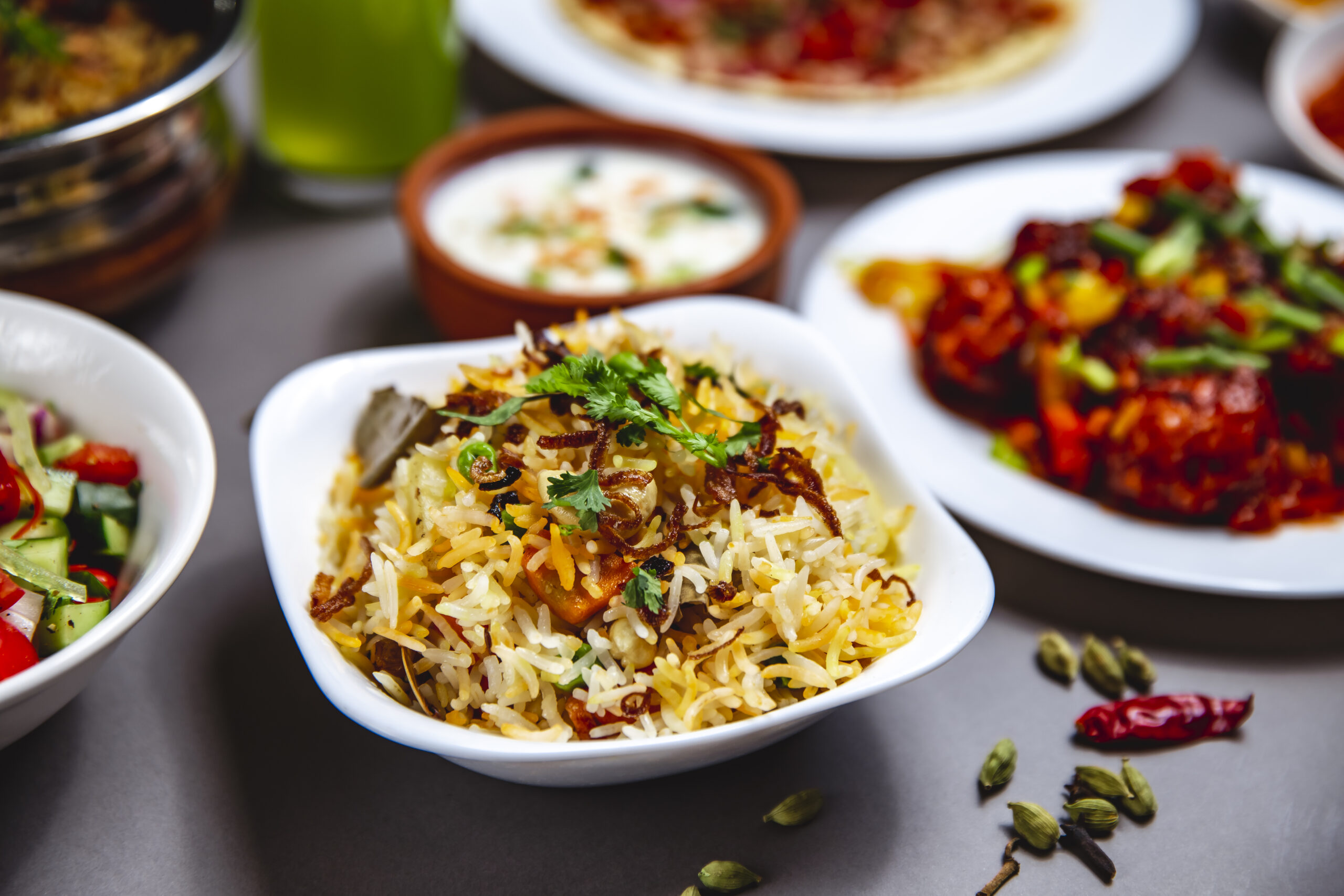 side-view-rice-garnish-with-fried-onion-carrot-greens-chili-pepper-table-scaled.jpg